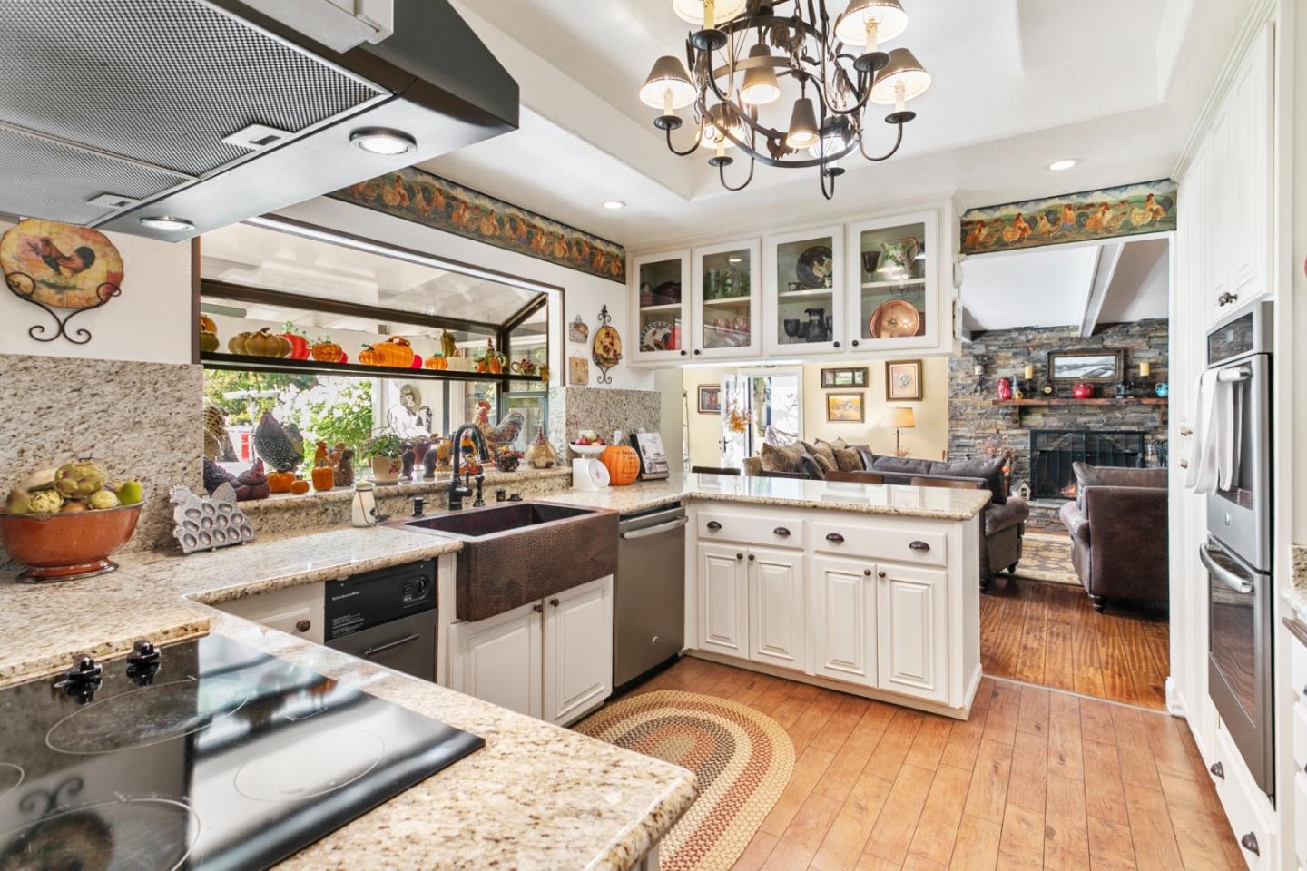 1990 Day Road Gilroy, CA 95020 - Photo 23 of 42 a kitchen with stainless steel appliances granite countertop a stove and cabinets