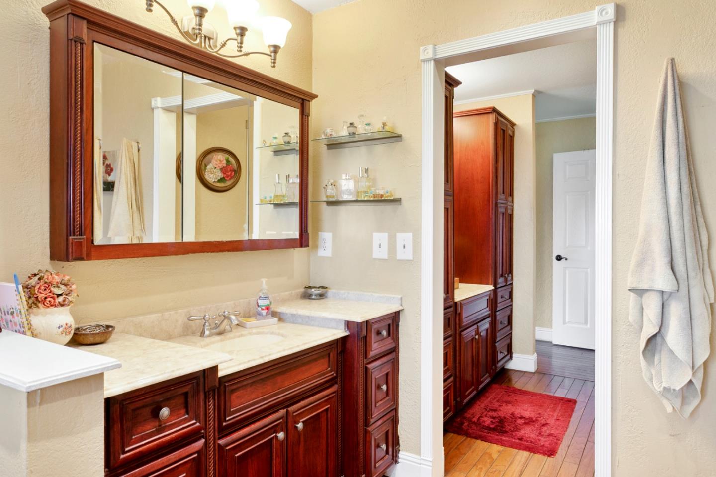 1990 Day Road Gilroy, CA 95020 - Photo 26 of 42 a bathroom with a sink and a mirror