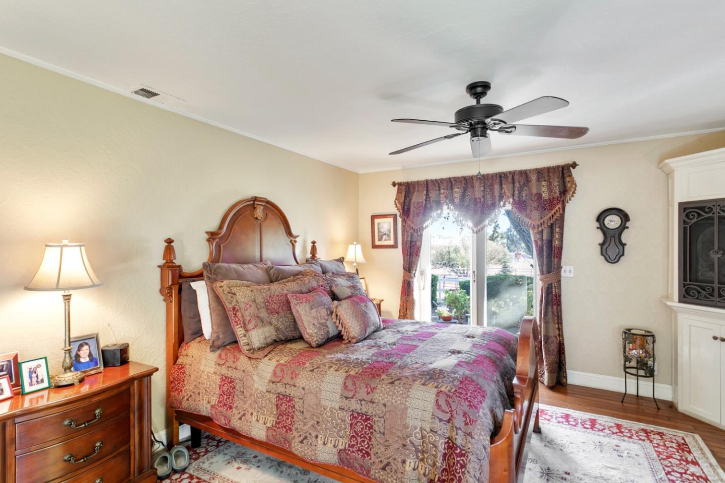 1990 Day Road Gilroy, CA 95020 - Photo 27 of 42 a bedroom with a bed a chandelier and a window