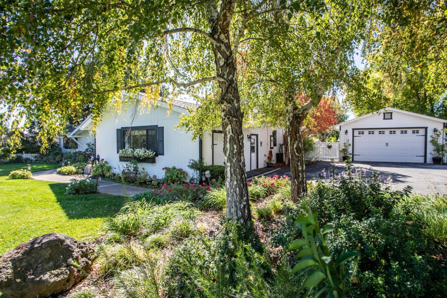 1990 Day Road Gilroy, CA 95020 - Photo 3 of 42 a front view of a house with garden