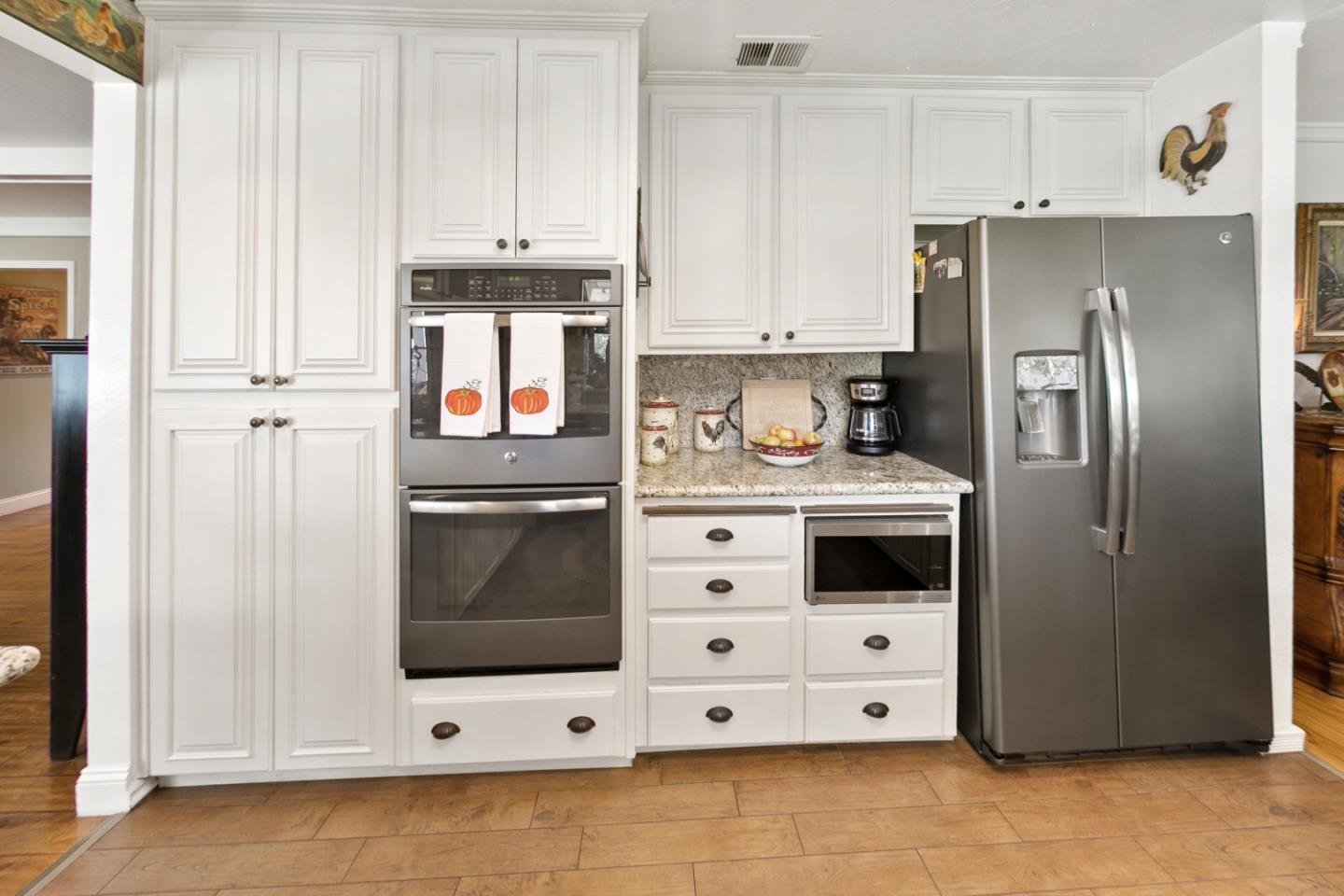 1990 Day Road Gilroy, CA 95020 - Photo 38 of 42 a kitchen with stainless steel appliances a stove a microwave and a refrigerator