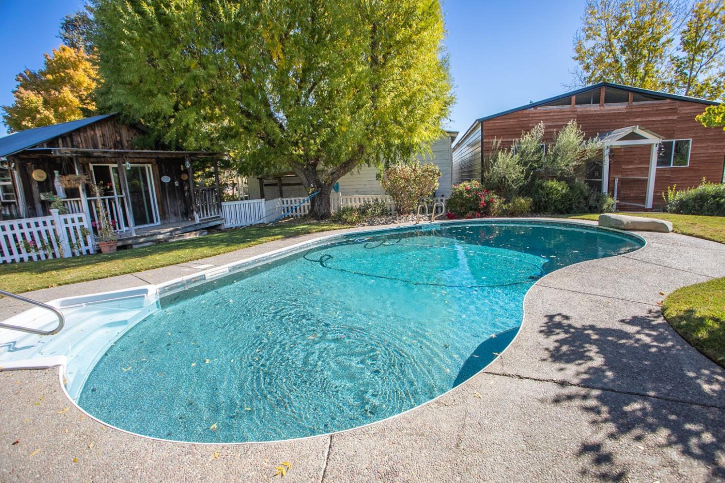 1990 Day Road Gilroy, CA 95020 - Photo 4 of 42 a view of a house with swimming pool and porch