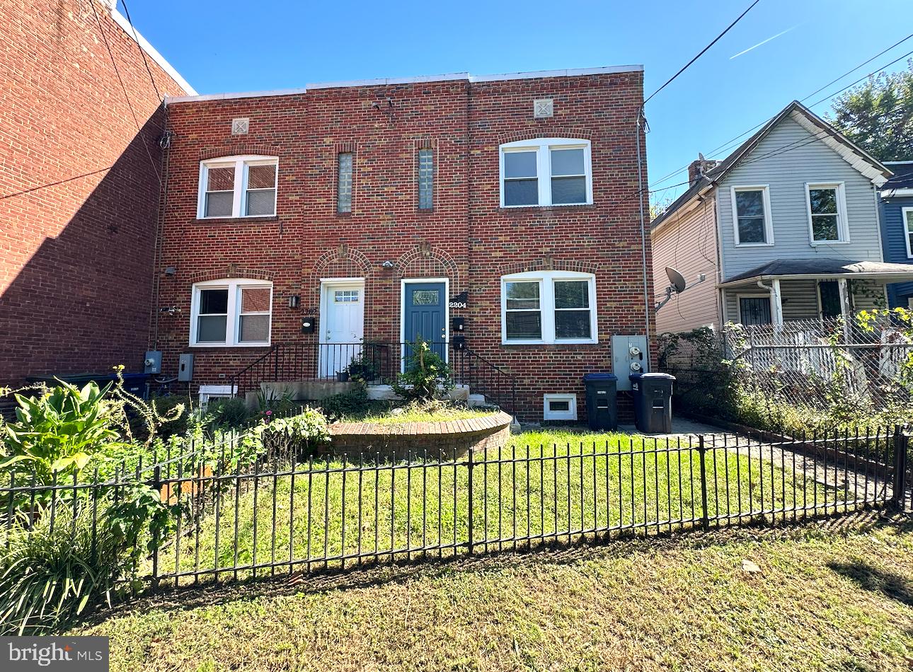 2204 16th Street Southeast, Unit 2 Washington, DC 20020 - Photo 1 of 11 a front view of a house with a garden