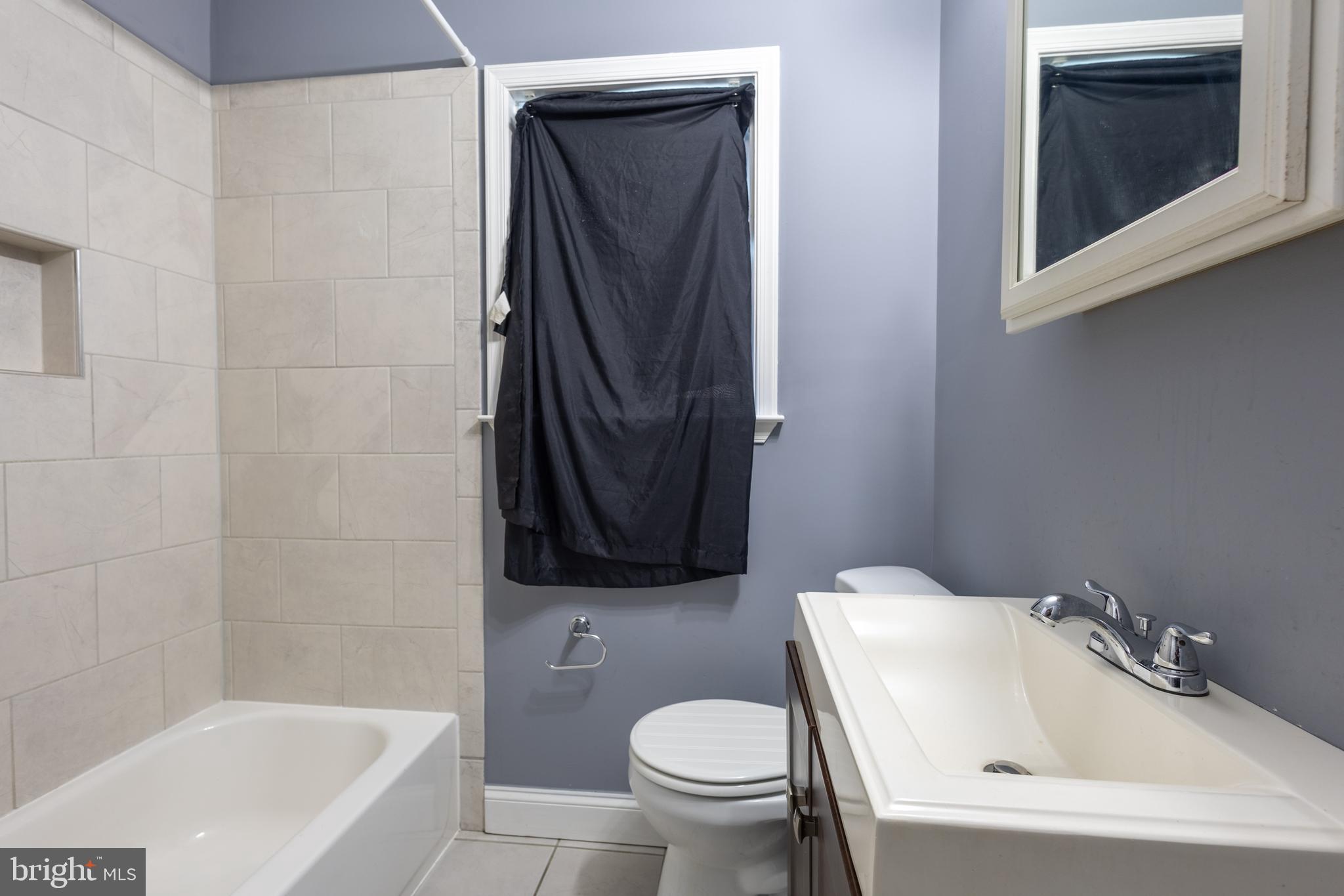 2204 16th Street Southeast, Unit 2 Washington, DC 20020 - Photo 11 of 11 a bathroom with a sink toilet and bathtub