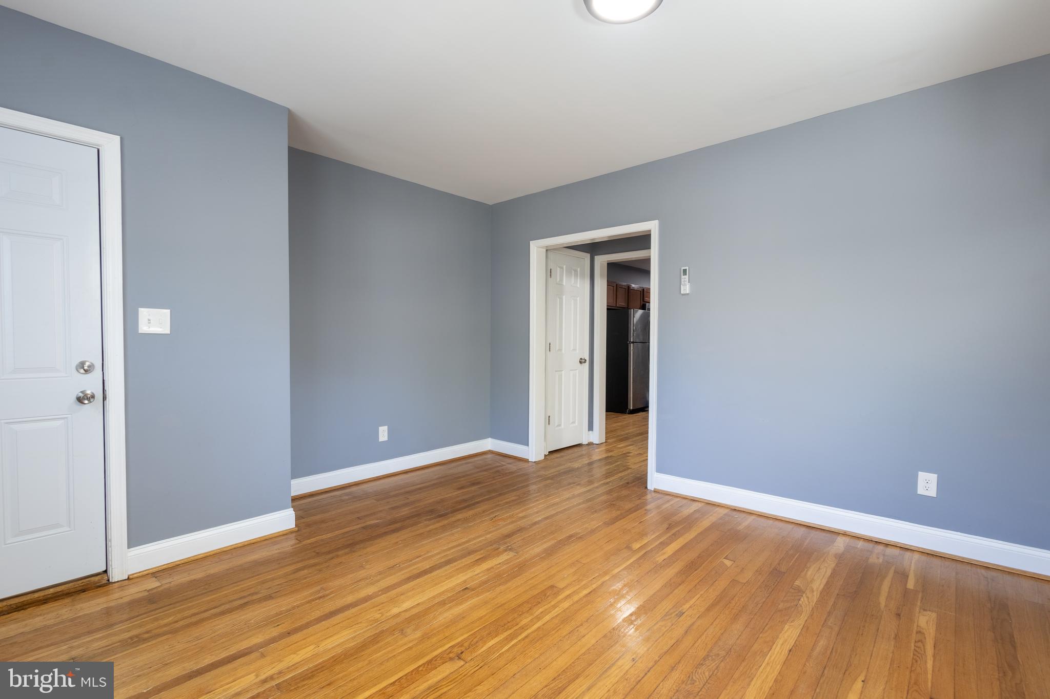 2204 16th Street Southeast, Unit 2 Washington, DC 20020 - Photo 6 of 11 a view of an empty room with wooden floor