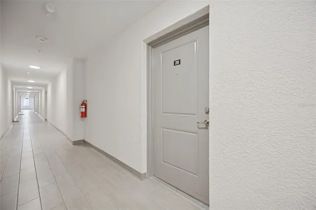 a view of hallway with wooden floor