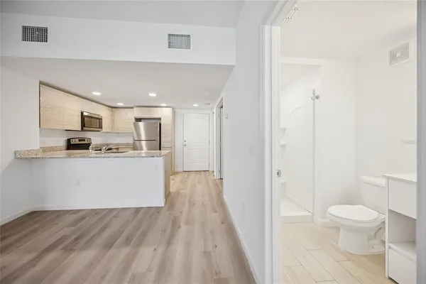 a view of kitchen with wooden floor