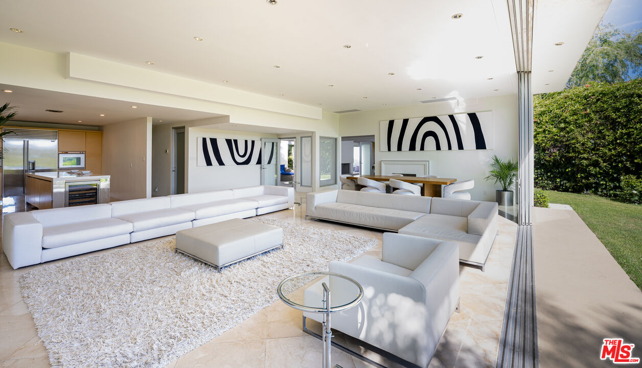 1466 Bel Air Road Los Angeles, CA 90077 - Photo 14 of 35 a bedroom with furniture and a large window