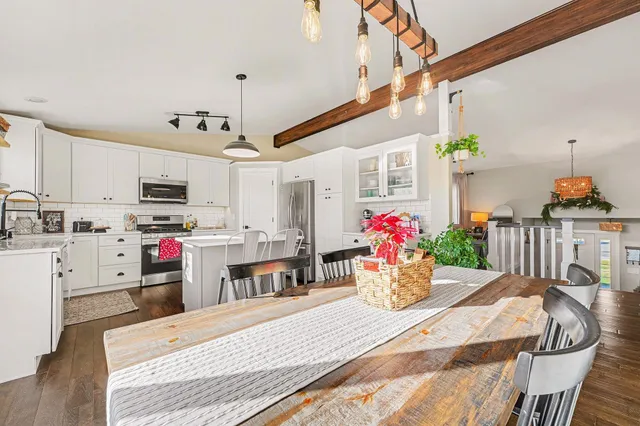 a kitchen view with microwave a stove and cabinets