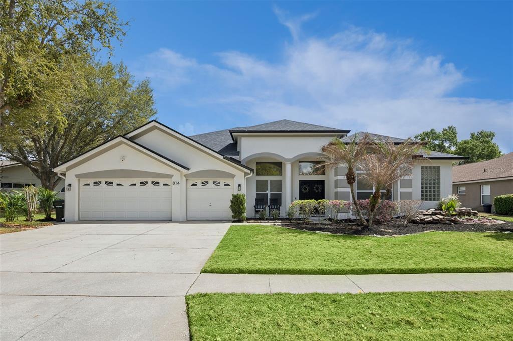 814 Grovesmere Loop Ocoee, FL 34761 - Photo 1 of 1 a front view of a house with a yard