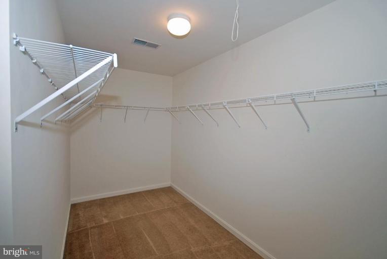 5970 Florey Road Hanover, MD 21076 - Photo 24 of 30 a view of a room with racks on the wall