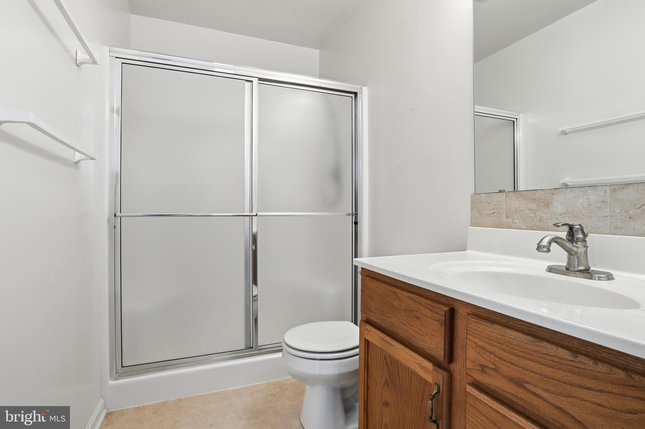 3004 Lakefield Road, Unit 3004 York, PA 17402 - Photo 25 of 33 a bathroom with a sink a toilet and vanity