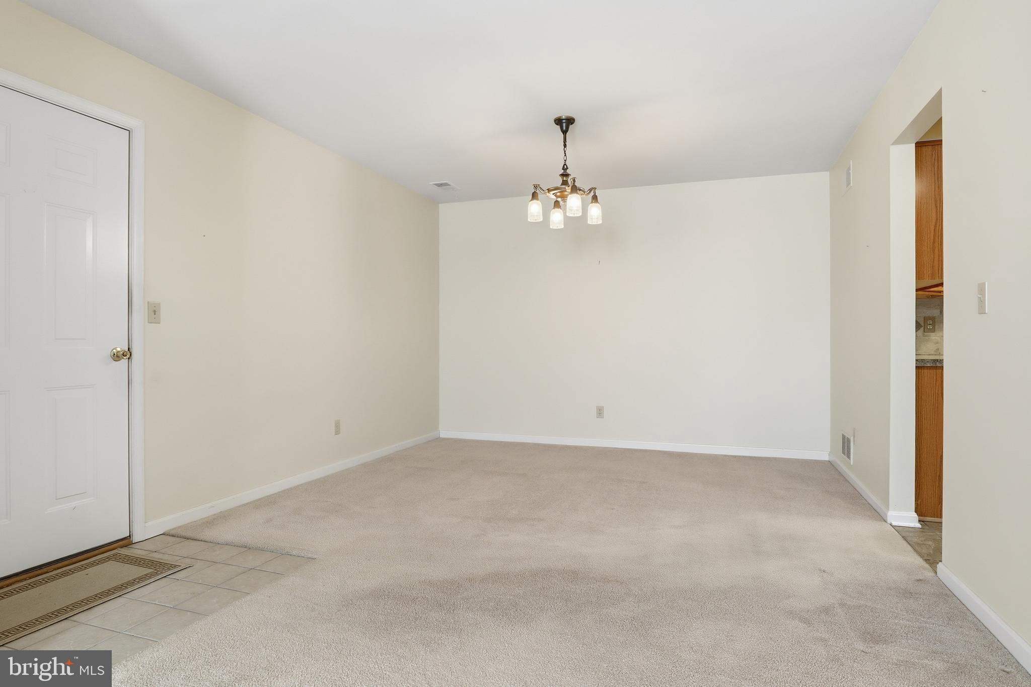 3004 Lakefield Road, Unit 3004 York, PA 17402 - Photo 8 of 33 a view of an empty room with a chandelier fan