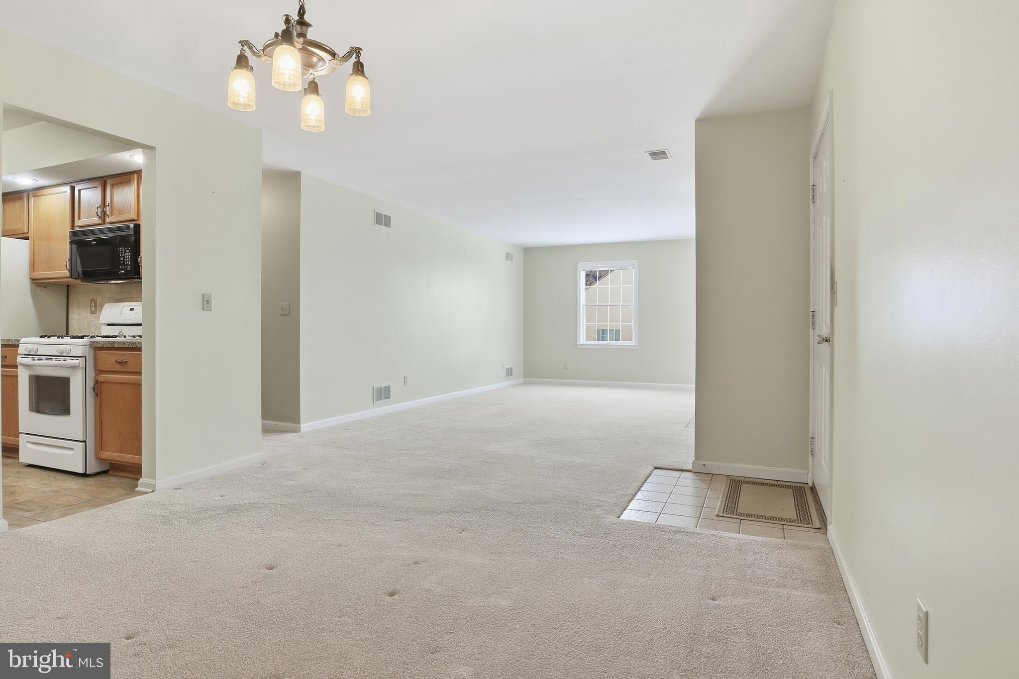 3004 Lakefield Road, Unit 3004 York, PA 17402 - Photo 9 of 33 a view of a chandelier fan and entryway
