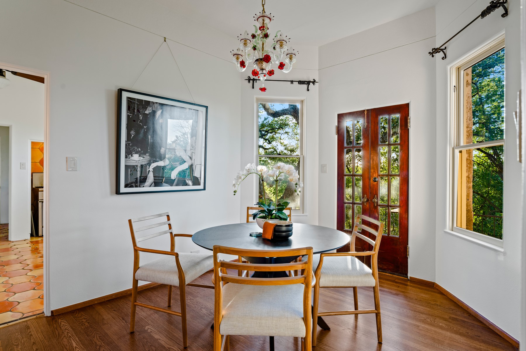806 Rosedale Terrace Austin, TX 78704 - Photo 11 of 40 a dining room with furniture a large window and wooden floor