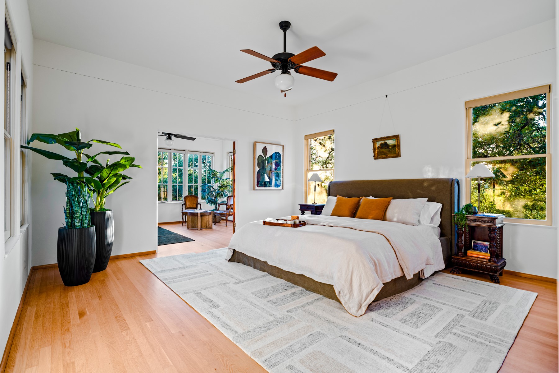 806 Rosedale Terrace Austin, TX 78704 - Photo 22 of 40 a bedroom with a bed potted plant and a large window