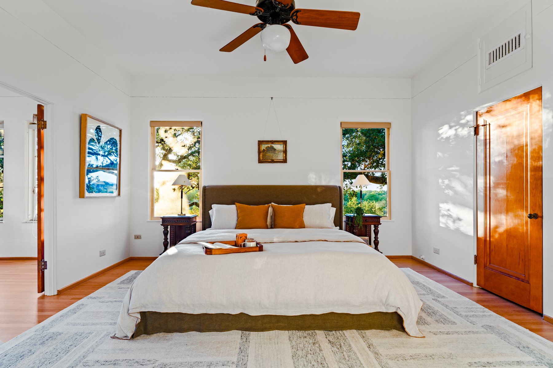 806 Rosedale Terrace Austin, TX 78704 - Photo 23 of 40 a bedroom with a bed and wooden floor