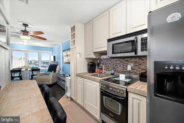 a kitchen with a stove microwave and sink