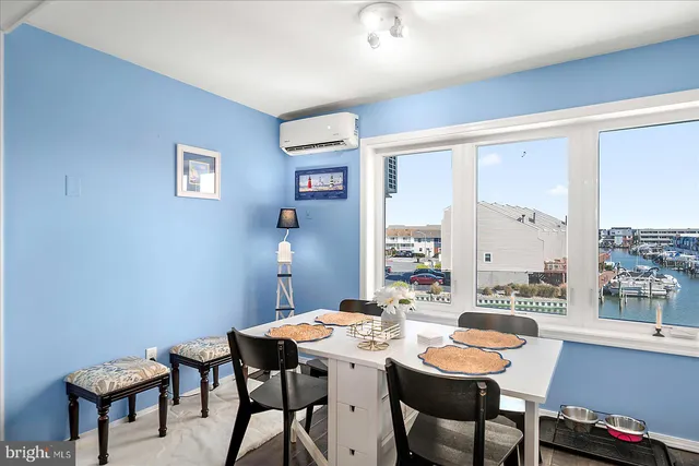 a view of a dining room with furniture and window