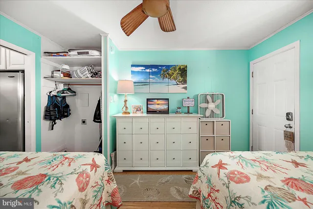 a bedroom with a bed and cabinets