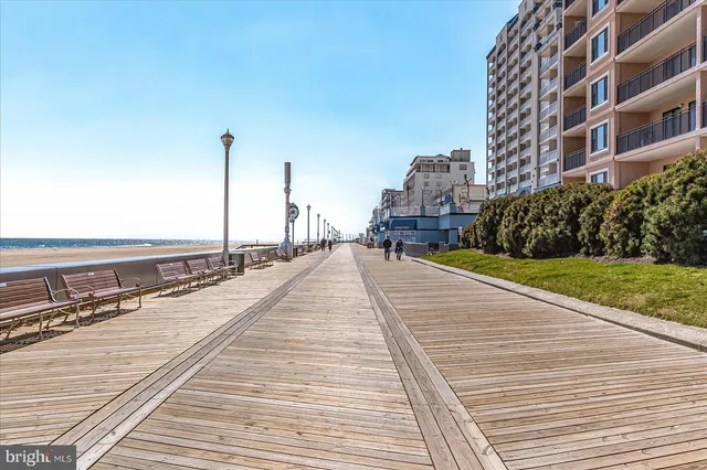 a view of a balcony with wooden floor and city view