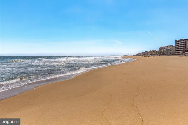 swimming pool view with a lake view