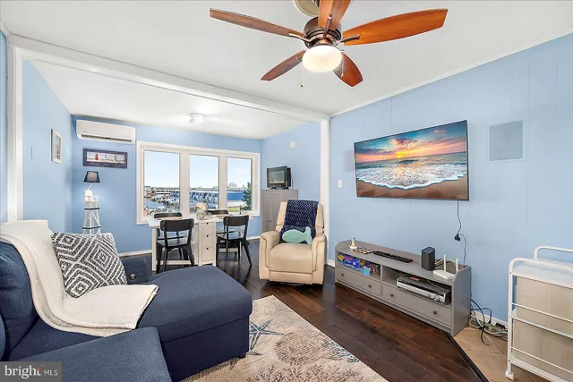 a bedroom with furniture and a flat screen tv
