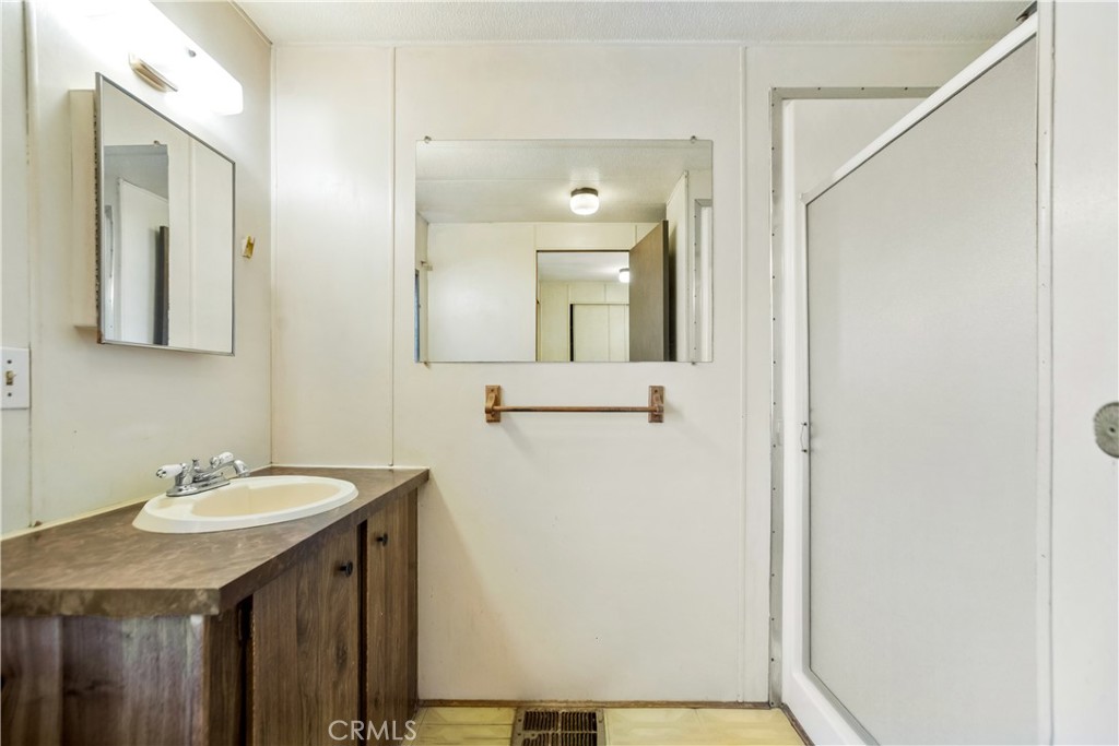3745 Valley Boulevard, Unit 50 Walnut, CA 91789 - Photo 16 of 32 a bathroom with a sink and a mirror