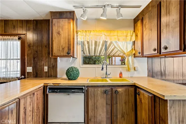a kitchen with a sink and a window