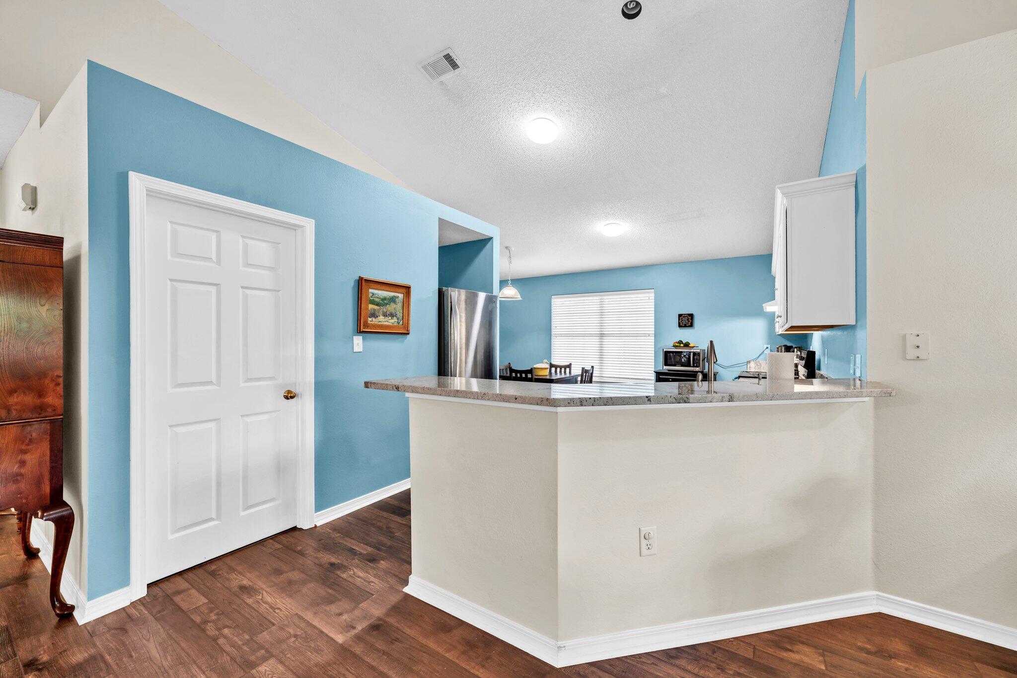 174 Bayou Landing Road Miramar Beach, FL 32550 - Photo 12 of 42 a view of kitchen with wooden floor