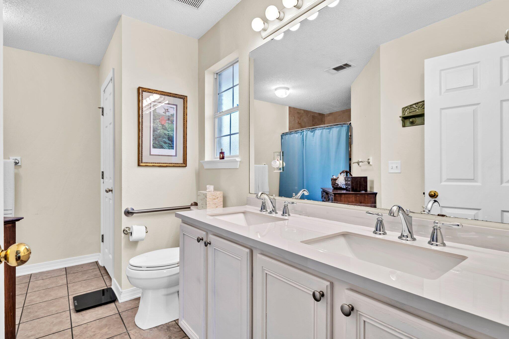174 Bayou Landing Road Miramar Beach, FL 32550 - Photo 27 of 42 a bathroom with a sink double vanity and a toilet