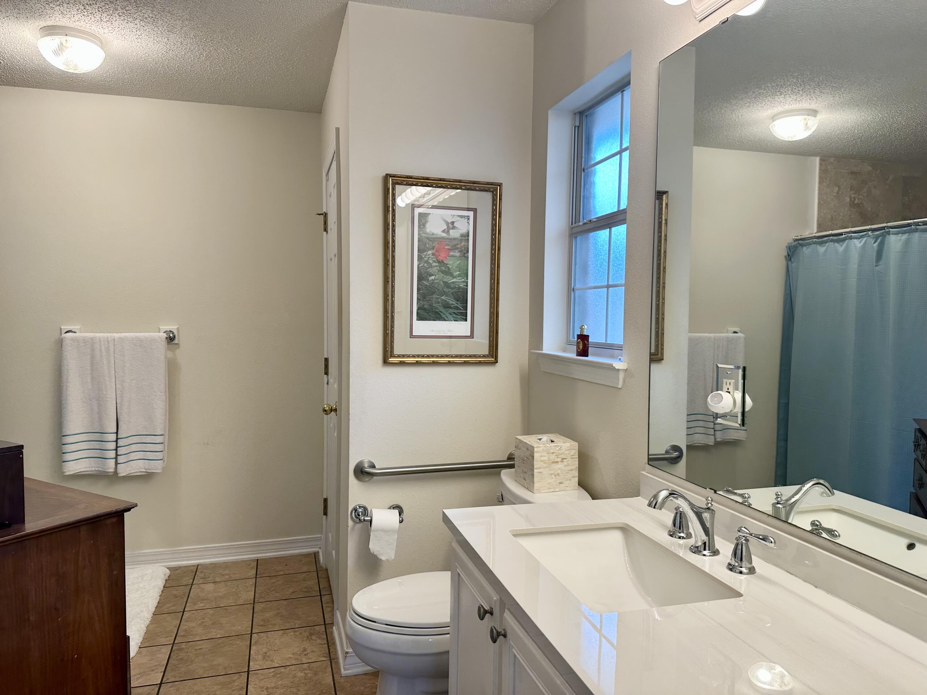 174 Bayou Landing Road Miramar Beach, FL 32550 - Photo 29 of 42 a bathroom with a granite countertop sink toilet and shower