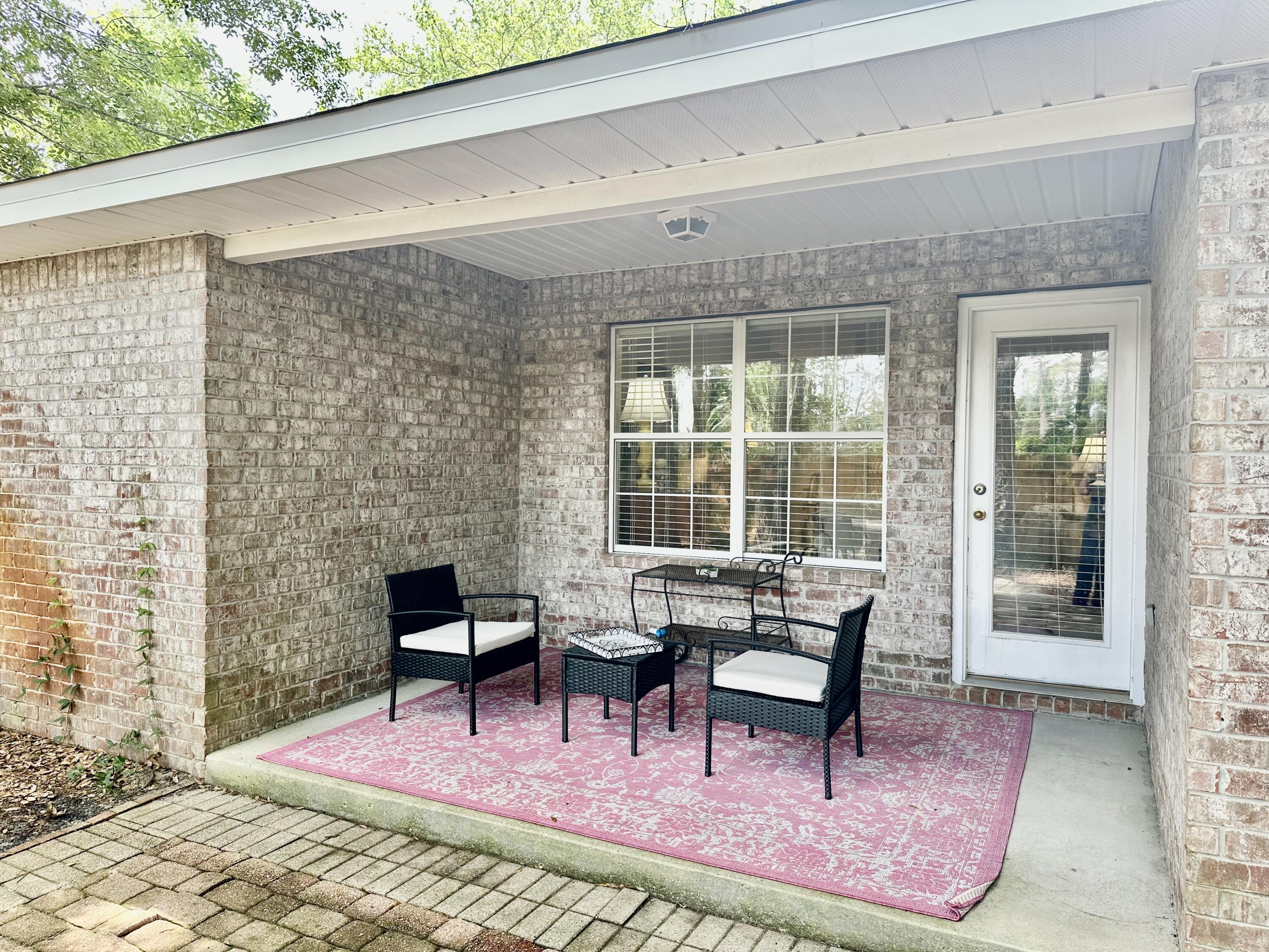 174 Bayou Landing Road Miramar Beach, FL 32550 - Photo 32 of 42 a balcony with chairs and with outdoor views