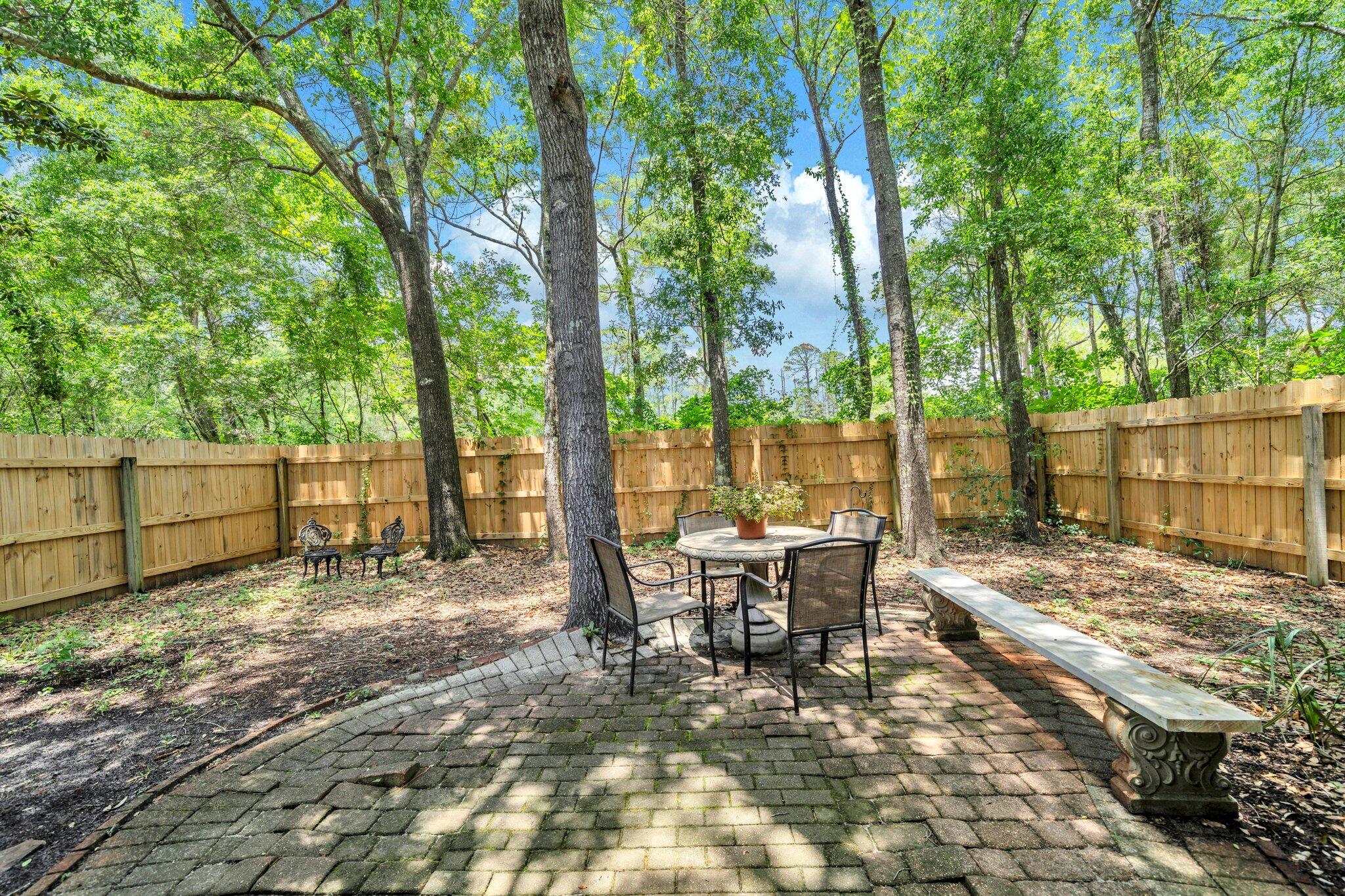 174 Bayou Landing Road Miramar Beach, FL 32550 - Photo 35 of 42 a view of a yard with patio and wooden fence