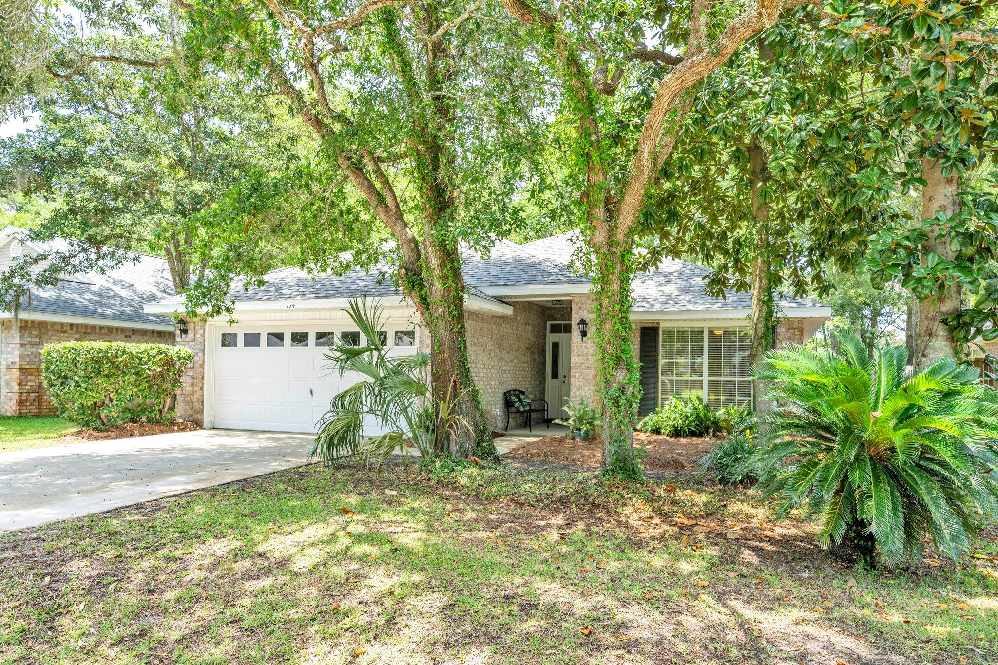 174 Bayou Landing Road Miramar Beach, FL 32550 - Photo 39 of 42 a front view of a house with garden