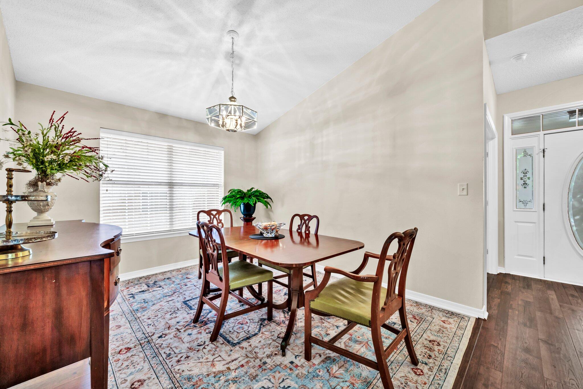 174 Bayou Landing Road Miramar Beach, FL 32550 - Photo 4 of 42 a view of a dining room with furniture and wooden floor
