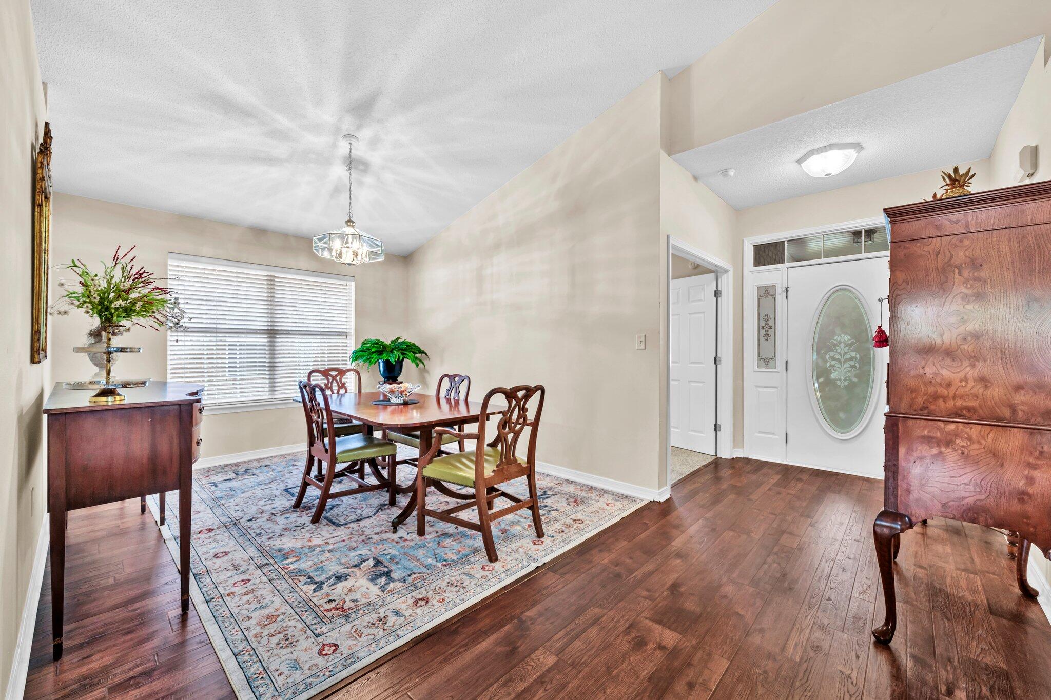 174 Bayou Landing Road Miramar Beach, FL 32550 - Photo 6 of 42 a view of a dining room with furniture and wooden floor