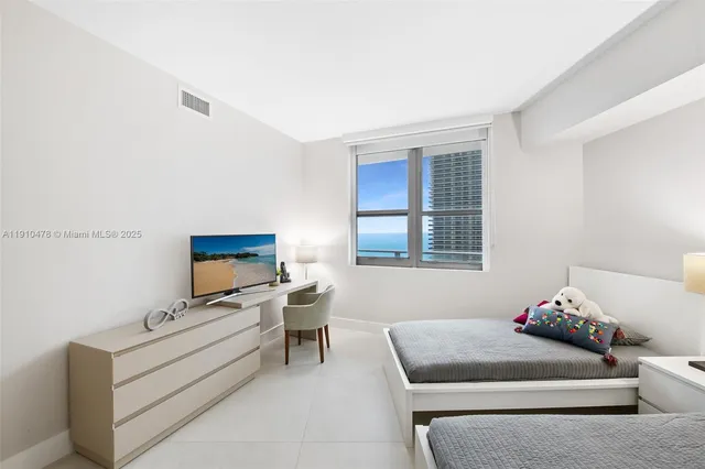 a view of bathroom with washer and dryer