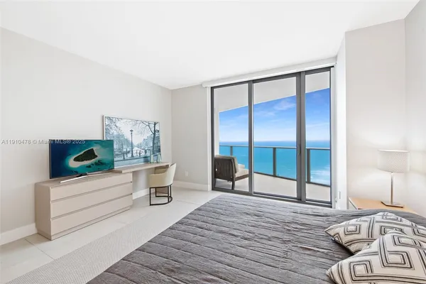 a view of spacious bathroom with dual sinks