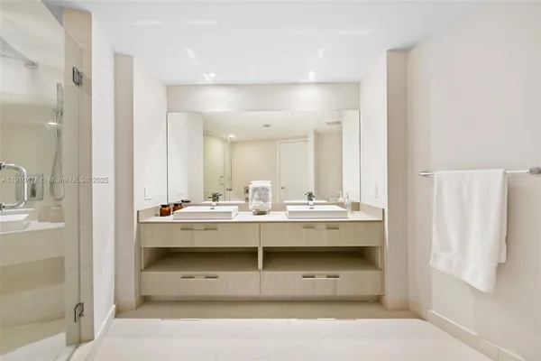a bathroom with a bathtub and a shower