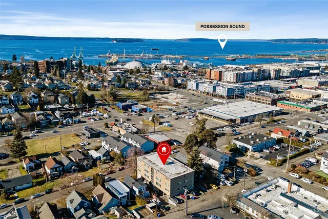 an aerial view of a parking space and city view