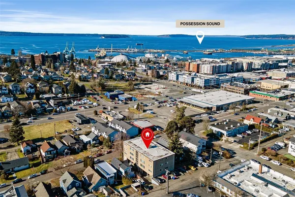 an aerial view of a parking space and city view