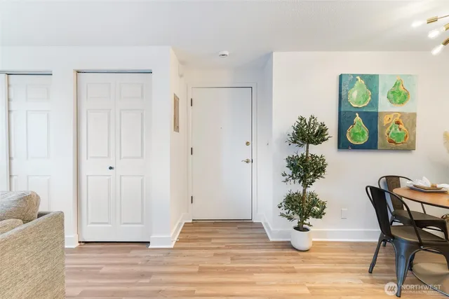 a view of a entryway with furniture and wooden floor