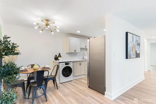 a view of a dining room with furniture and wooden floor