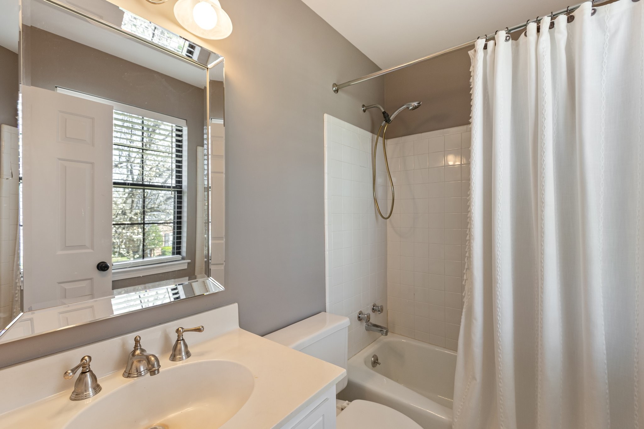 1216 General George Patton Road Nashville, TN 37221 - Photo 19 of 32 a bathroom with a granite countertop sink toilet and shower
