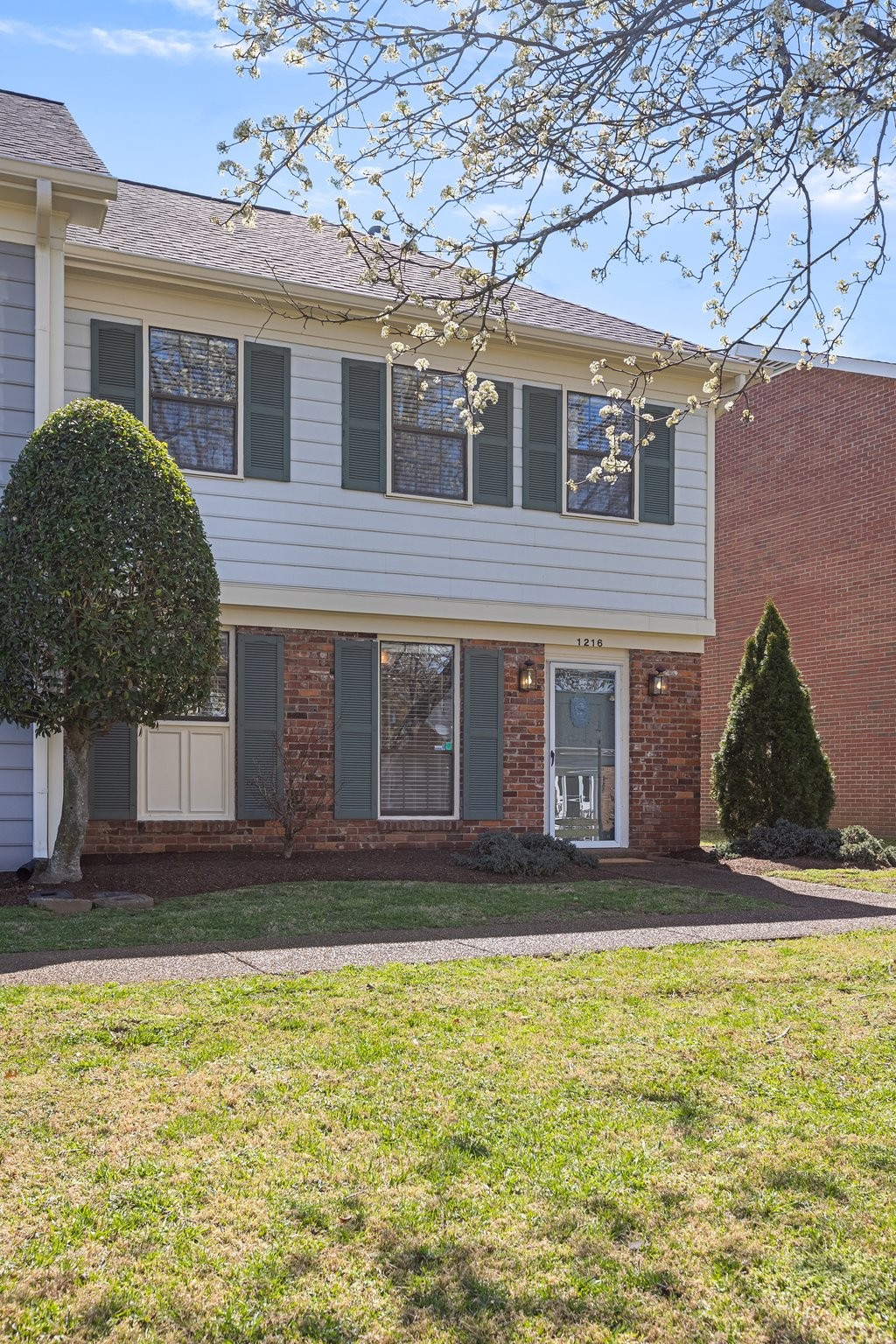 1216 General George Patton Road Nashville, TN 37221 - Photo 2 of 32 a view of a house with a yard