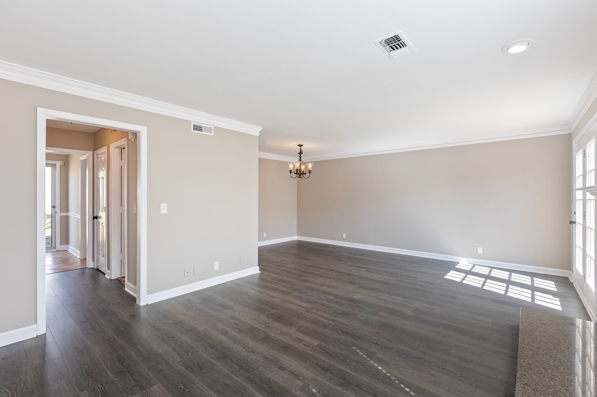 1216 General George Patton Road Nashville, TN 37221 - Photo 8 of 32 an empty room with wooden floor and windows