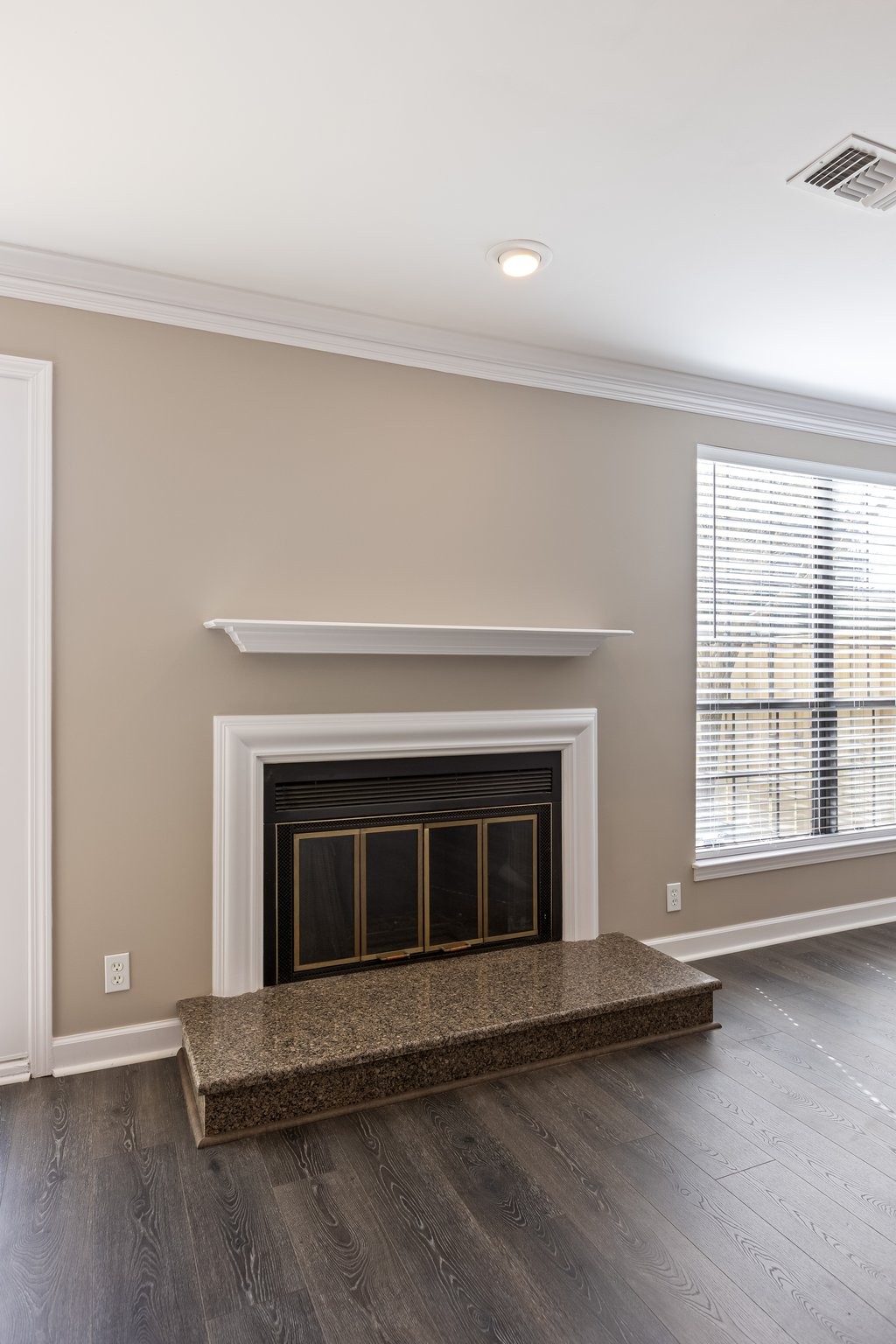 1216 General George Patton Road Nashville, TN 37221 - Photo 10 of 32 a living room with a fireplace and a floor to ceiling window