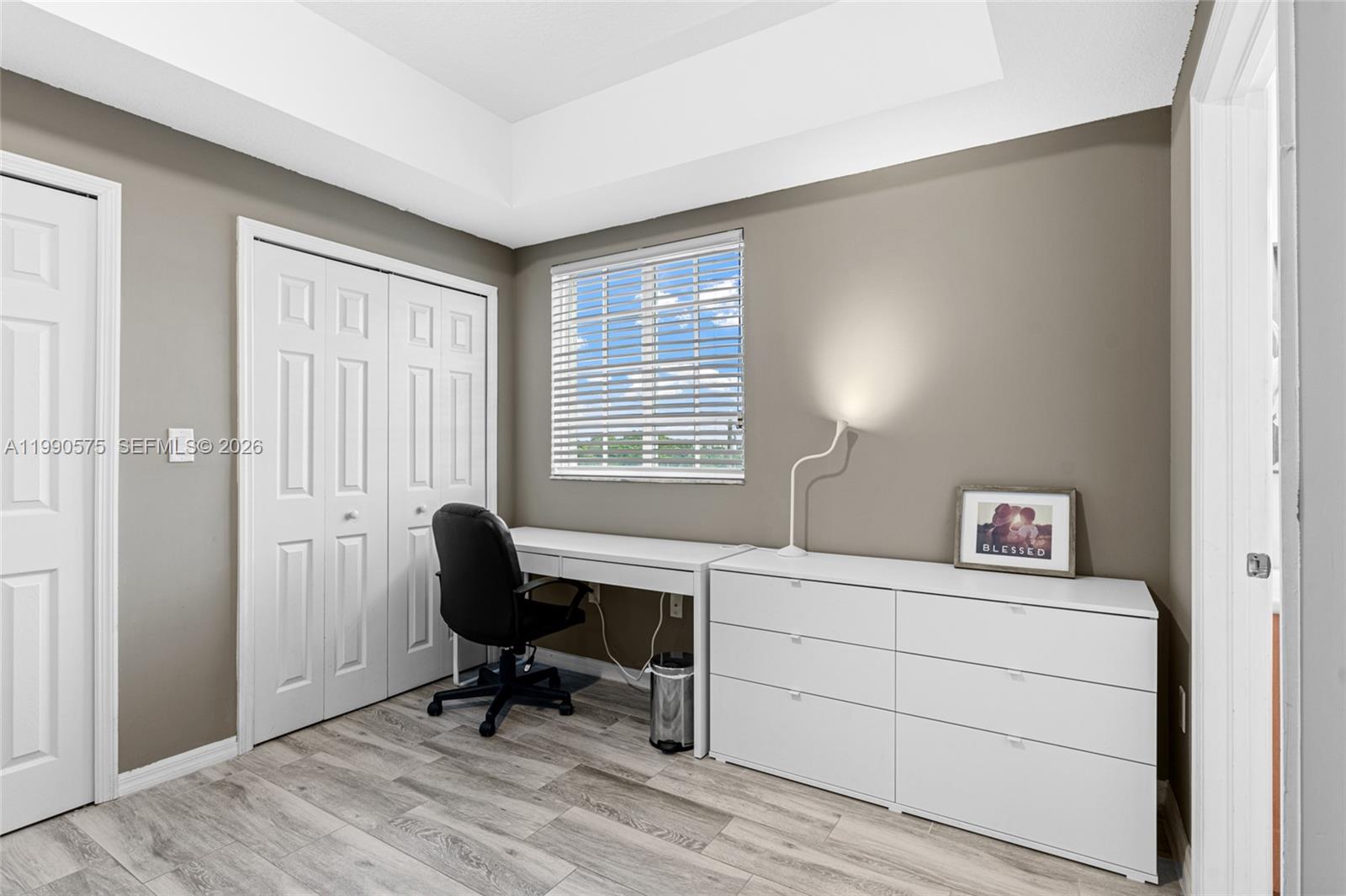 5271 Southwest 8th Street, Unit 315 Miami, FL 33134 - Photo 14 of 25 a view of a workspace with furniture and a window