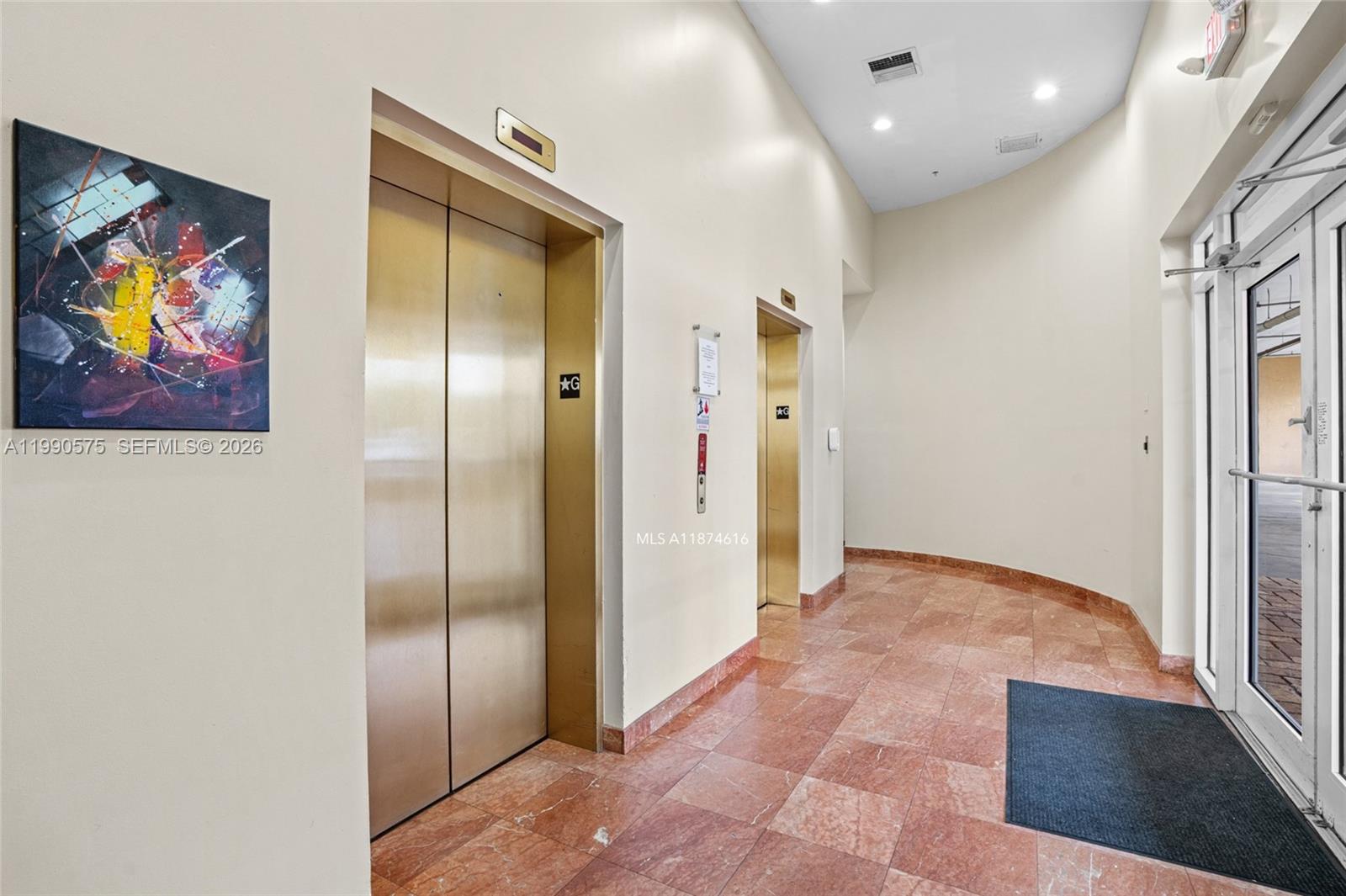 5271 Southwest 8th Street, Unit 315 Miami, FL 33134 - Photo 18 of 25 a view of a hallway with wooden floor